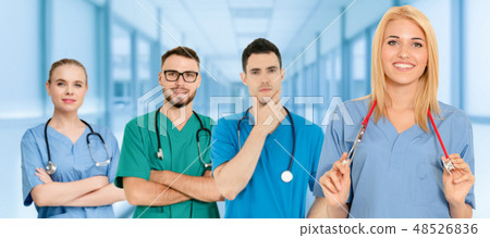 Doctor working in hospital with other doctors. Doctor working in hospital with other doctors. 48526836