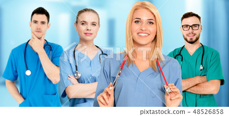 Doctor working in hospital with other doctors. Doctor working in hospital with other doctors. 48526858