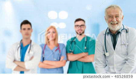 Doctor working in hospital with other doctors. Doctor working in hospital with other doctors. 48526859