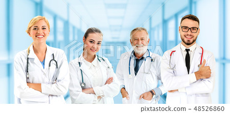 Doctor working in hospital with other doctors. Doctor working in hospital with other doctors. 48526860