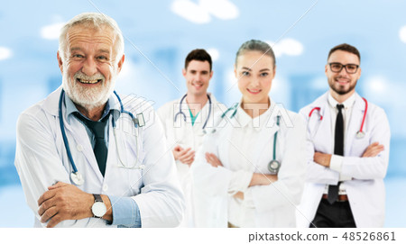 Doctor working in hospital with other doctors. Doctor working in hospital with other doctors. 48526861