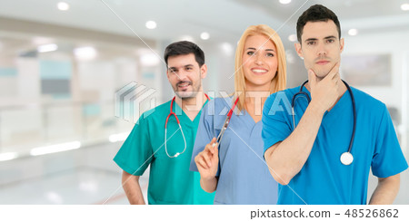 Doctor working in hospital with other doctors. Doctor working in hospital with other doctors. 48526862