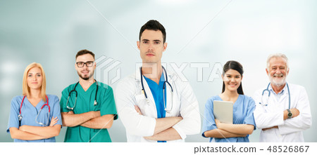 Doctor working in hospital with other doctors. Doctor working in hospital with other doctors. 48526867