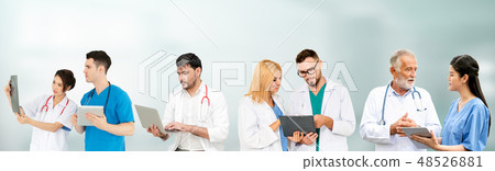 Doctor working in hospital with other doctors. Doctor working in hospital with other doctors. 48526881