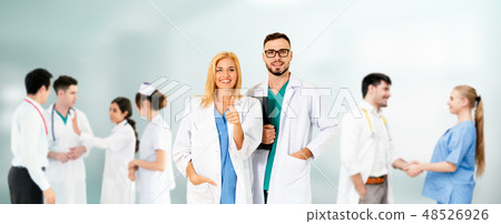 Doctor working in hospital with other doctors. 48526926