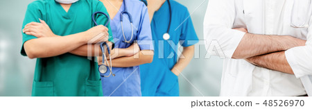 Doctor working in hospital with other doctors. Doctor working in hospital with other doctors. 48526970