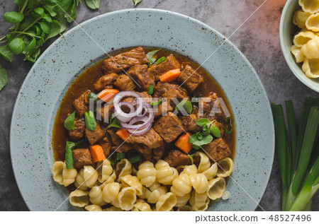 Goulash stew slow cook with pasta Goulash stew slow cook with pasta 48527496