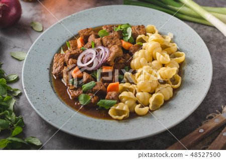 Goulash stew slow cook with pasta Goulash stew slow cook with pasta 48527500