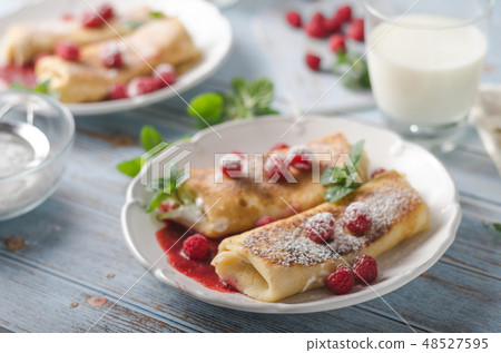 Cheese blintzes pancakes with fresh fruit Cheese blintzes pancakes with fresh fruit 48527595