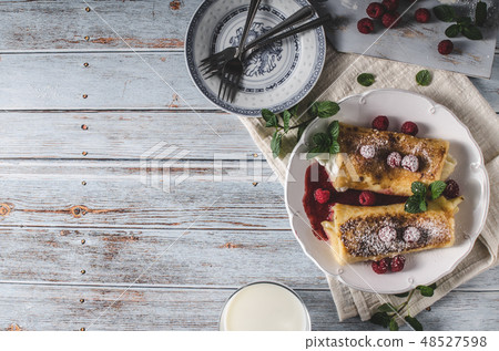 Cheese blintzes pancakes with fresh fruit 48527598