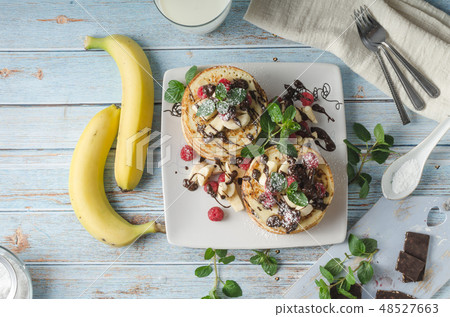 Homemade chocolate banana pancakes 48527663