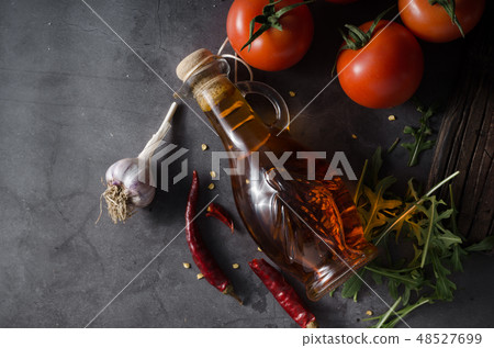 Homemade olive oil with tomatoes and chilli Homemade olive oil with tomatoes and chilli 48527699