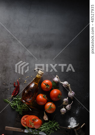 Homemade olive oil with tomatoes and chilli 48527935