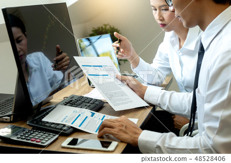 business man and woman sit at ther table business man and woman sit at ther table 48528406