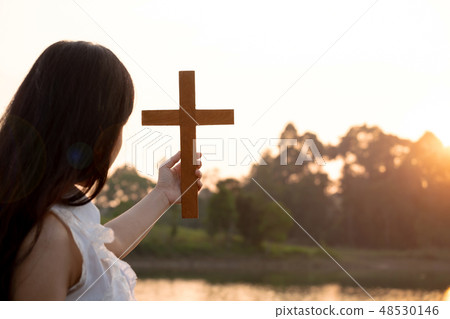 Girl Picking up the Wood Cross from the River. Girl Picking up the Wood Cross from the River. 48530146