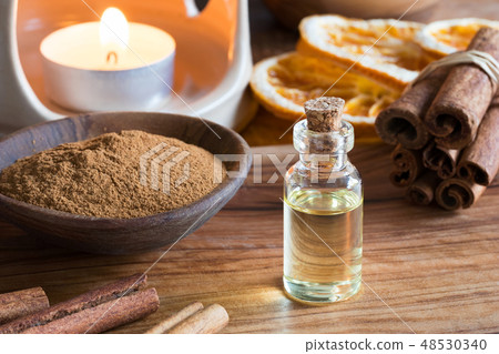 A bottle of cinnamon essential oil 48530340
