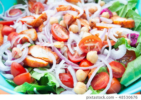 Salad with grilled chicken, cherry tomatoes, corn salad, chick p Salad with grilled chicken, cherry tomatoes, corn salad, chick p 48530676