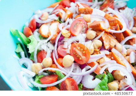 Salad with grilled chicken, cherry tomatoes, corn salad, chick p Salad with grilled chicken, cherry tomatoes, corn salad, chick p 48530677