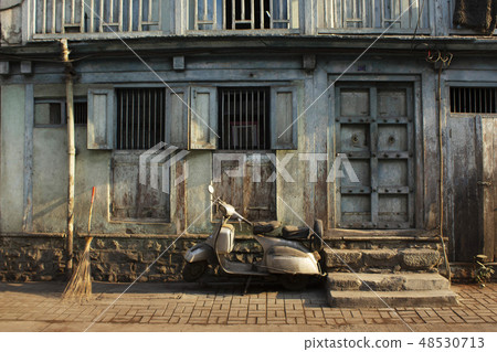 Old home and scooter parked outside, Pune street Old home and scooter parked outside, Pune street 48530713