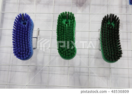 plastic cleaning brushes in supermarket hanger ; 48530809