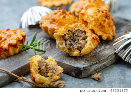 Homemade mini-pies with meat filling. 48531875