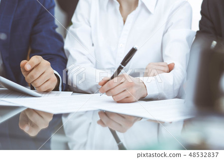 Businessman using laptop at meeting, closeup of hands. Business operations concept Businessman using laptop at meeting, closeup of hands. Business operations concept 48532837