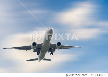 An Airplane is Flying in The Clouds Sky An Airplane is Flying in The Clouds Sky 48533413