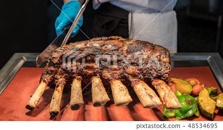 Chef carving beef 48534695