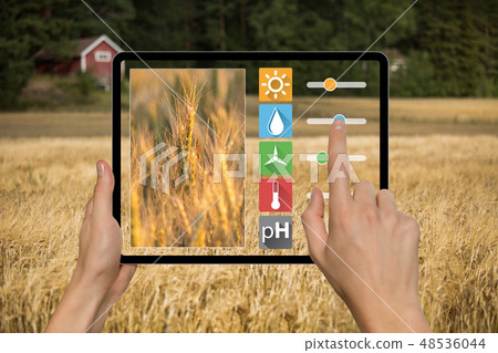 Farmer with tablet 48536044