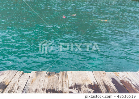 Pov on raft with people snorkeling in sea Pov on raft with people snorkeling in sea 48536519