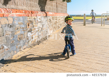 Children riding bicycles in Glenelg Children riding bicycles in Glenelg 48537639