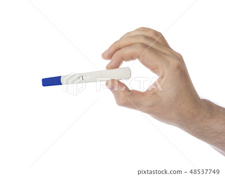 Hand with pregnancy test 48537749