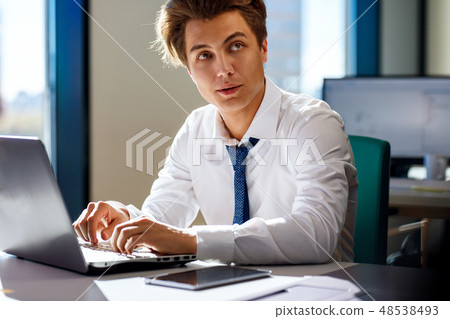 Businessman working on laptop in the office. 48538493
