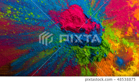 Abstract colorful Happy Holi background. Color vibrant powder on wood. Dust colored splash texture Abstract colorful Happy Holi background. Color vibrant powder on wood. Dust colored splash texture 48538875