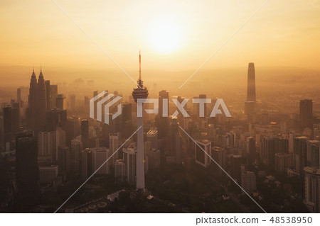 Menara Kuala Lumpur Tower with the sun. Aerial view of Kuala Lum 48538950