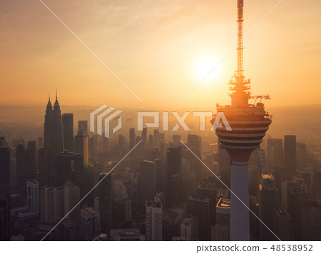 Menara Kuala Lumpur Tower with the sun. Aerial view of Kuala Lum 48538952