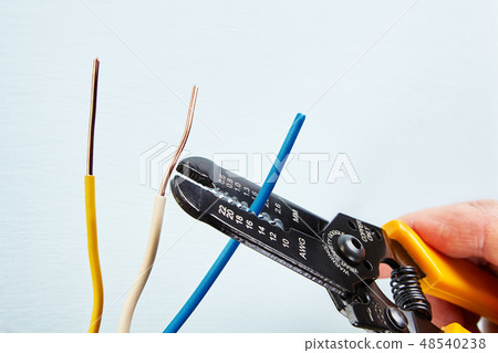 Using  wire stripper cutter. 48540238