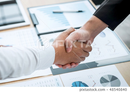 Finishing up a conversation after collaboration, handshake of tw 48540840