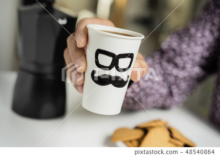 man with cup of coffee with a man face 48540864