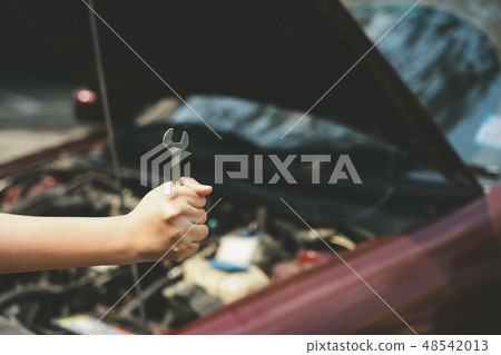 mechanical engineer hands open the car skirt  48542013