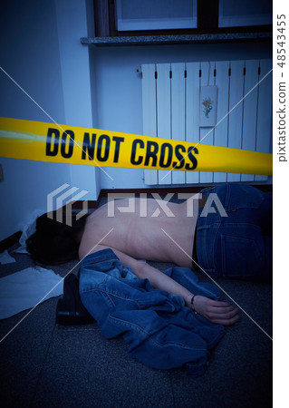 victim lying on the floor - crime scene 48543455