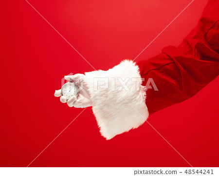 Santa holding a stopwatch in hand 48544241