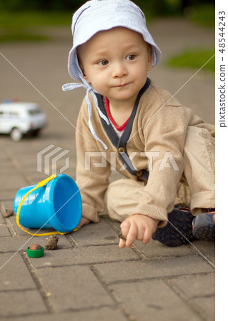 Baby Boy Playing on the Ground in The Par Baby Boy Playing on the Ground in The Par 48544243