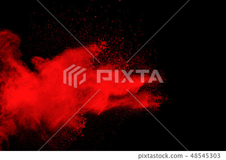 Red color powder explosion on black background 48545303