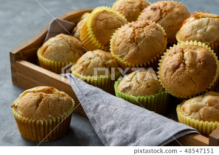 Homemade banana muffins on wooden tray. Homemade banana muffins on wooden tray. 48547151