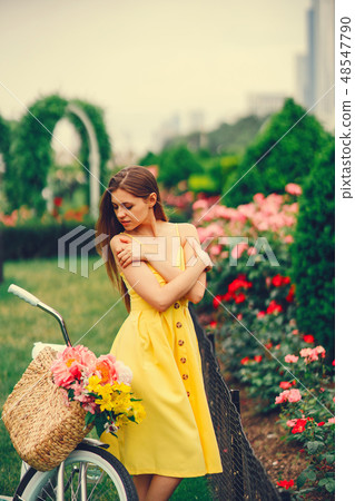 pretty girl with bicycle 48547790