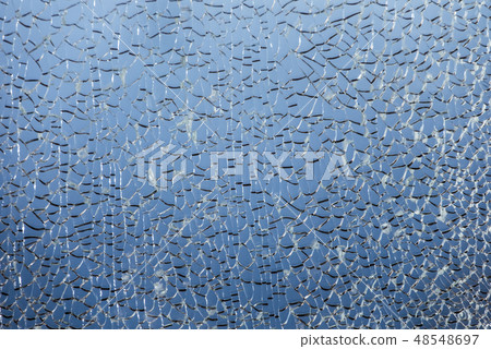 Close-up of abstract shattered broken glass texture Close-up of abstract shattered broken glass texture 48548697