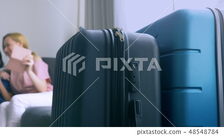 The concept of tourism, online shopping, tours. happy family preparing to travel at home. Sit on the 48548784