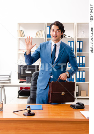 Young handsome judge sitting in courtroom   48549457