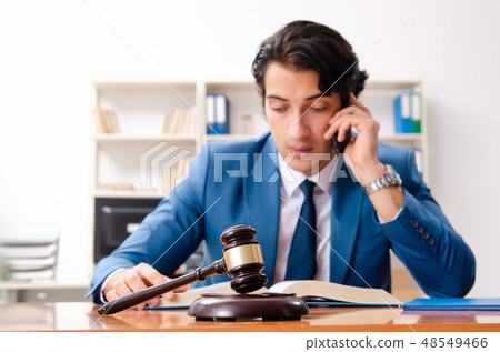 Young handsome judge sitting in courtroom   48549466